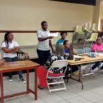 Volunteers and health professionals conduct health checks at the Takoradi Ghana Stake Center.