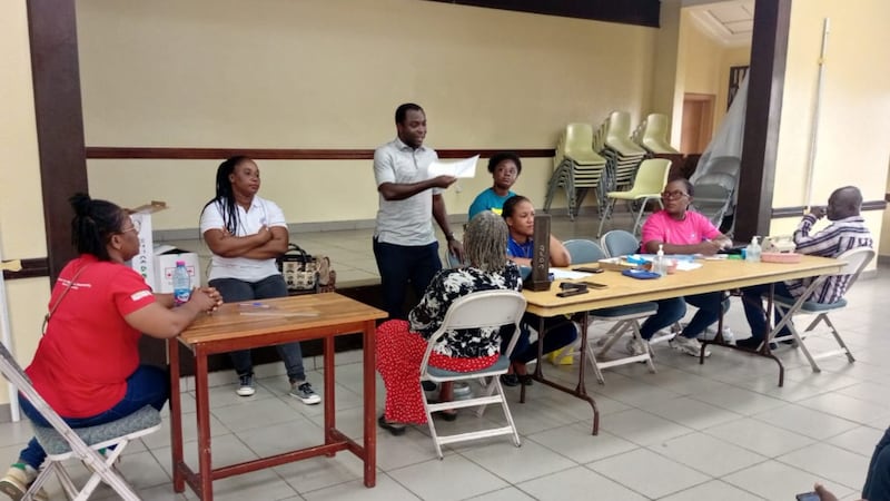 Volunteers and health professionals conduct health checks at the Takoradi Ghana Stake Center.